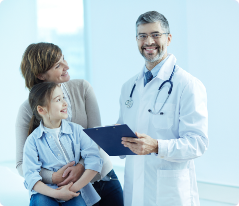 Happy doctor holding a clipboard with patients